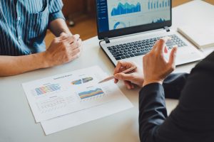 Two businessman consult analyzing company financial cash flow result. Concept for teamwork business